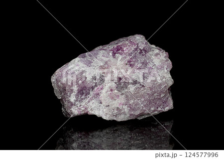 Lepidolite crystal ore on dark background 124577996