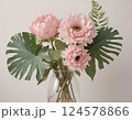 Pink Peony Bouquet with Monstera Leaves in Glass Vase 124578866