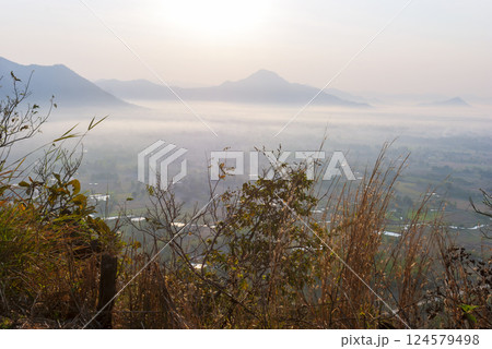 Scenic view dramatic beautiful sunset sky. Natural Sunset Sunrise on meadow silhouette shadow dark land. Vibrant dramatic sky on sunset, dawn, sunrise in Countryside. Landscape Colorful Sky At Sunset 124579498