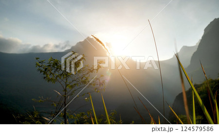 Blue golden sky sunrise dramatic beautiful landscape mountain. Dawn sky gold dusk time cloudscape with sunlight. Dramatic sunset over mountain landscape. Beautiful landscape foggy hills twilight time 124579586