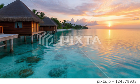 Overwater Bungalows in a Crystal-Clear Turquoise Lagoon with Stunning Sunset View 124579935