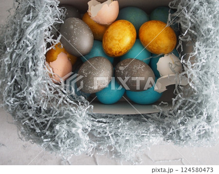 Bright Eggs laid out in nest 124580473