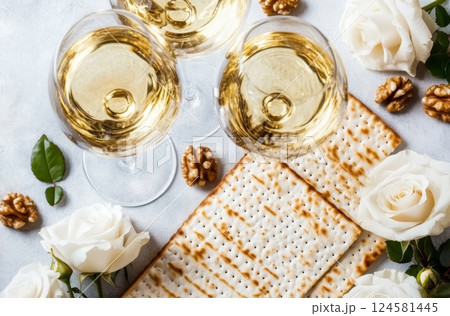 Passover celebration composition with wine, matzah, white roses, and walnuts 124581445