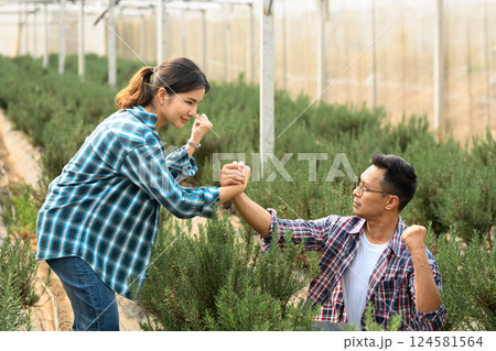 Successful farming partners celebrating in their agricultural achievements Successful farming partners celebrating in their agricultural achievements 124581564