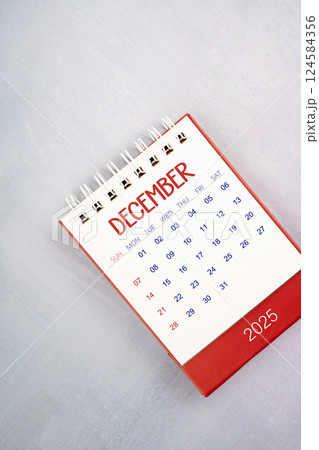 December 2025 on gray wooden table, Flat lay. 124584356