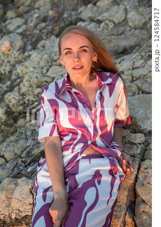 Beautiful slender blonde woman in silk suit 124584717