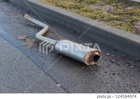 Exhaust pipe fallen of a junker car 124584974