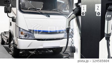Electric vehicles charging station on a background of a truck Electric vehicles charging station on a background of a truck 124585604
