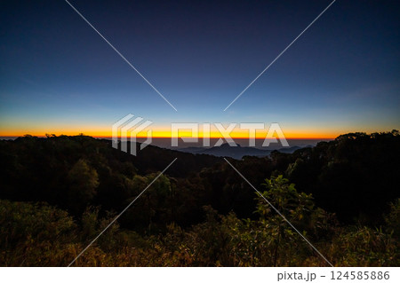 The beautiful sunrise at Doi intanon national park, Chiang Mai in the morning.Sun is rising from the hill to shy with beautiful yellow orange light. 124585886