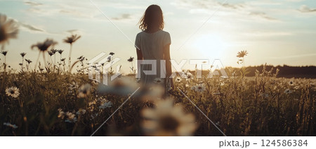 Woman walking through daisy field at sunset. AI-generated item 124586384
