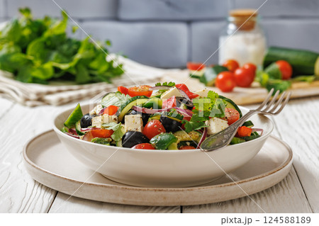 greek salad of veggies, olives, cheese in bowl greek salad of veggies, olives, cheese in bowl 124588189
