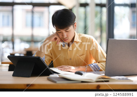 University student reviewing notes and preparing for an important exam 124588991