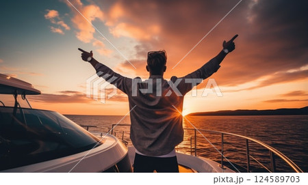 Man wearing sunglasses and casual attire leaps with joy on the deck of a luxurious yacht, basking in the sunset and carefree travel lifestyle 124589703