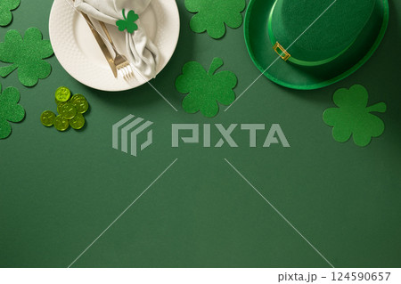 St Patrick's Day party table setting with green decoration on green background. 124590657