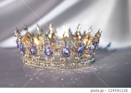 Royal golden crown with amethyst gemstones and diamonds 124591126