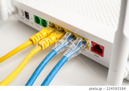 Ethernet cable with wireless router connect to internet service provider internet network. Ethernet cable with wireless router connect to internet service provider internet network. 124591584