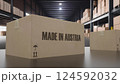 Boxes with MADE IN AUSTRIA text on conveyor. 3d illustration 124592032