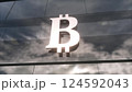 Bitcoin currency sign on a modern glass skyscraper. 3d illustration 124592043
