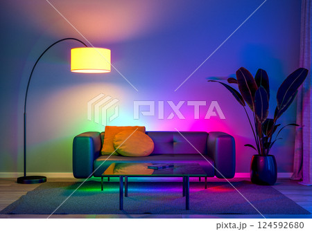a modern living room with ambient LED lighting and comfortable furniture. 3D render 124592680