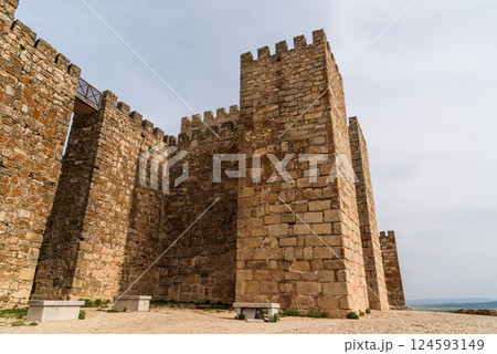 The imposing medieval castle of Trujillo in Extremadura, Spain, rises majestically against the sky. 124593149