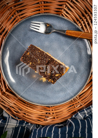 A piece of cake with poppy seeds. A piece of cake with poppy seeds. 124593307