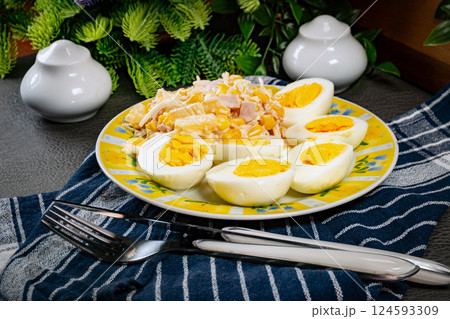 Breakfast. Hard-boiled eggs with ham, pineapple and corn salad. Breakfast. Hard-boiled eggs with ham, pineapple and corn salad. 124593309