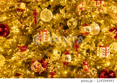Christmas tree with glass balls, bird, red icicles. 124594943