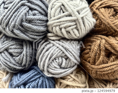 Colorful Wool Yarn Skeins Arranged in a Neat Pile 124594979