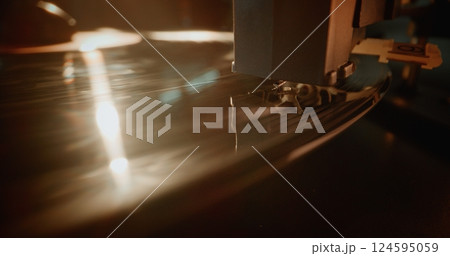 Macro Close Up of Needle Scratching Grooves, Playing Authentic Analog Music on Vinyl Record Player Macro Close Up of Needle Scratching Grooves, Playing Authentic Analog Music on Vinyl Record Player 124595059
