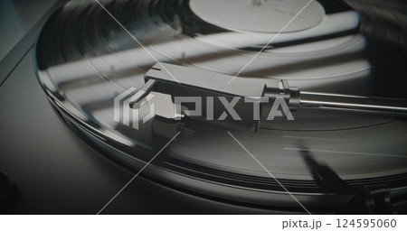 Vinyl Record Rotating. Stylus Needle Touching Grooves, Playing Sound on Vinyl Record Player 124595060