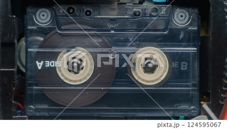 Retro Audio Cassette Tape Playing 90s Mixtapes Sound, Reels Spinning Retro Audio Cassette Tape Playing 90s Mixtapes Sound, Reels Spinning 124595067
