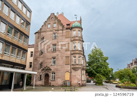 Nuremberg, Germany, August 1, 2023. Shot of a historic building with characteristic slanted windows on the left. Rainy day, travel destinations. 124596719