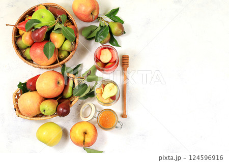 Apple-pear cider with honey, juice. Diet and weight loss concept, jewish new year Rosh Hashanah background. Apples help cleanse the body and reduce weight. Healthy eating, body detoxification Apple-pear cider with honey, juice. Diet and weight loss concept, jewish new year Rosh Hashanah background. Apples help cleanse the body and reduce weight. Healthy eating, body detoxification 124596916