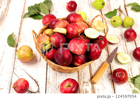 Autumn composition of apples in box on sunny wooden table, thanksgiving background, harvest, healthy natural food concept, detox diet and body cleansing, banner on screen, cafe, restaurant, selective 124597054