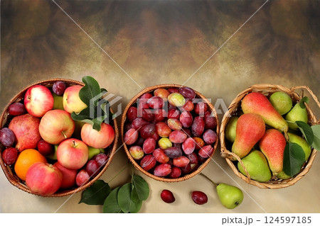 Apples, pears and plums in baskets on a sunny wooden table, thanksgiving background, village harvest, healthy natural food concept, detox diet and body cleansing, screen banner, cafe, restaurant, 124597185