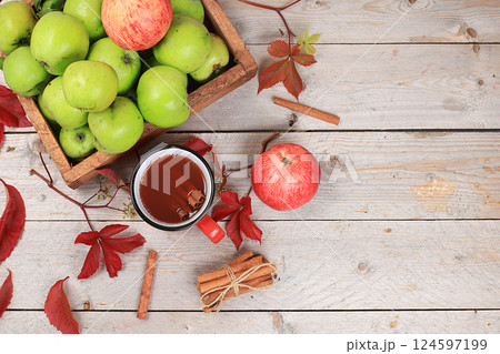 Apple cider, juice or fruit drink and ingredients on a sunny table. The concept of diet and weight loss. Apples help cleanse the body and reduce weight. Healthy eating, body detoxification Apple cider, juice or fruit drink and ingredients on a sunny table. The concept of diet and weight loss. Apples help cleanse the body and reduce weight. Healthy eating, body detoxification 124597199