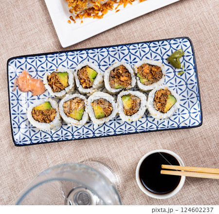 Set of rolls with fish and vegetables with Chinese chopsticks Set of rolls with fish and vegetables with Chinese chopsticks 124602237