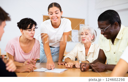Group of people attending language course Group of people attending language course 124602298