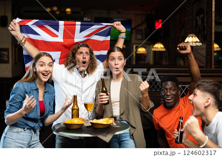 United Kingdom sports fans supporting their favourite team in pub United Kingdom sports fans supporting their favourite team in pub 124602317