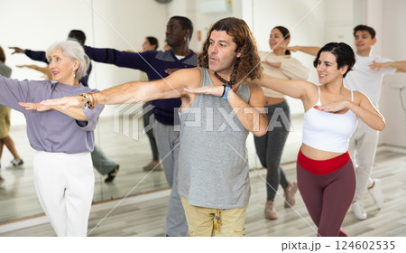 Emotional man learning dynamic dances in choreography class 124602535