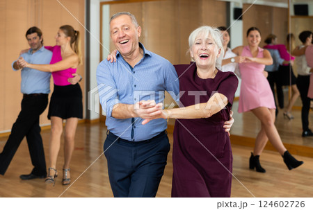 Elderly pair practicing Latino dance in dance studio 124602726