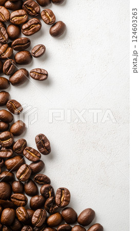 Coffee beans scattered on blank canvas background Coffee beans scattered on blank canvas background 124603263