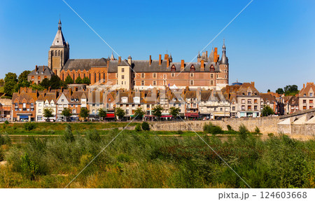 Ancient Chateau de Gien rising above townhouses on bank of Loire Ancient Chateau de Gien rising above townhouses on bank of Loire 124603668