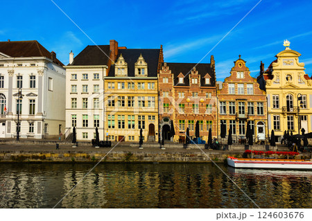 Medieval buildings in historical center of Ghent reflecting in water of river Leie Flanders Medieval buildings in historical center of Ghent reflecting in water of river Leie Flanders 124603676