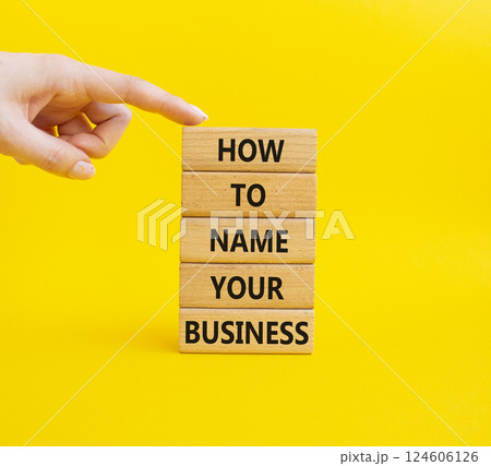 Business symbol. Wooden blocks with words How to name your Business. Businessman hand. Beautiful yellow background. Business How to name your Business concept. Copy space. Business symbol. Wooden blocks with words How to name your Business. Businessman hand. Beautiful yellow background. Business How to name your Business concept. Copy space. 124606126