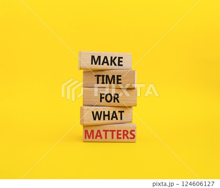 Important thing symbol. Wooden blocks with words Make time for what matters. Beautiful yellow background. Business and important thing concept. Copy space. 124606127