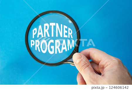 Partner Program symbol. Concept words Partner Program on magnifying glass. Businessman hand. Beautiful blue background. Business and Partner Program concept. Copy space. Partner Program symbol. Concept words Partner Program on magnifying glass. Businessman hand. Beautiful blue background. Business and Partner Program concept. Copy space. 124606142