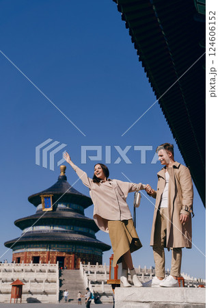 lovely couple exploring tourist attractions in Beijing China. Couple exploring temple of heaven in Beijing China. Couple experiencing chinese culture and architecture. lovely couple exploring tourist attractions in Beijing China. Couple exploring temple of heaven in Beijing China. Couple experiencing chinese culture and architecture. 124606152