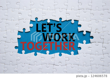 Lets work together symbol. Concept words Lets work together on white puzzle. Beautiful blue background Business and Lets work together concept. Copy space. Lets work together symbol. Concept words Lets work together on white puzzle. Beautiful blue background Business and Lets work together concept. Copy space. 124606578