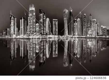 Skyscrapers and Urban city skyline over water, black and white style, city background, Dubai Marina bay UAE Skyscrapers and Urban city skyline over water, black and white style, city background, Dubai Marina bay UAE 124606636